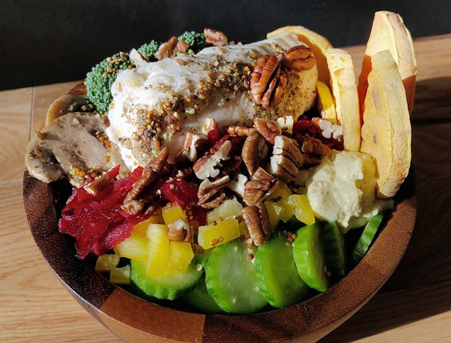 Colorful and vitamin rich Buddha Bowl with halibut fillet