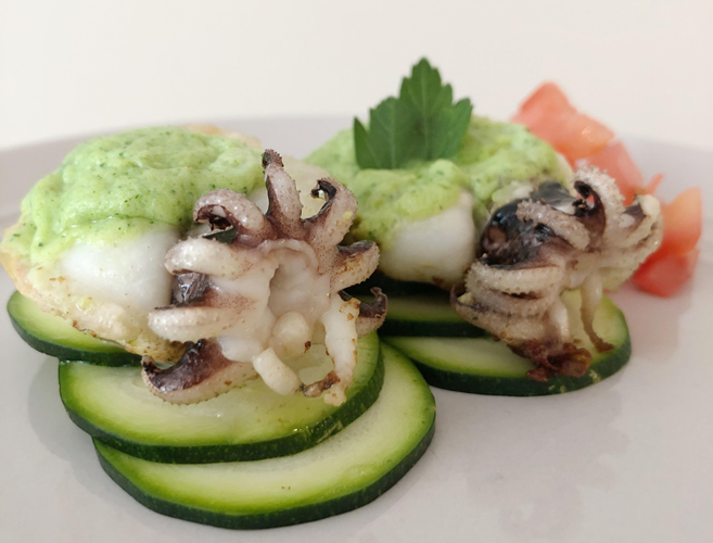 Whole cuttlefish stuffed with flan vert served over zucchini rounds